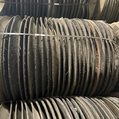 Multiple traffic barrel tire rings shown tied together