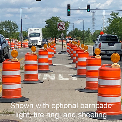 Shows a wide angle of traffic drum in use on the road