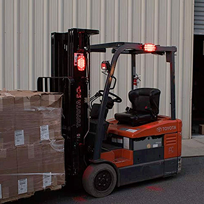 Foxfire portable magnetic led signal light 4-pack w/case - side view of fork lift shown with 1 red l